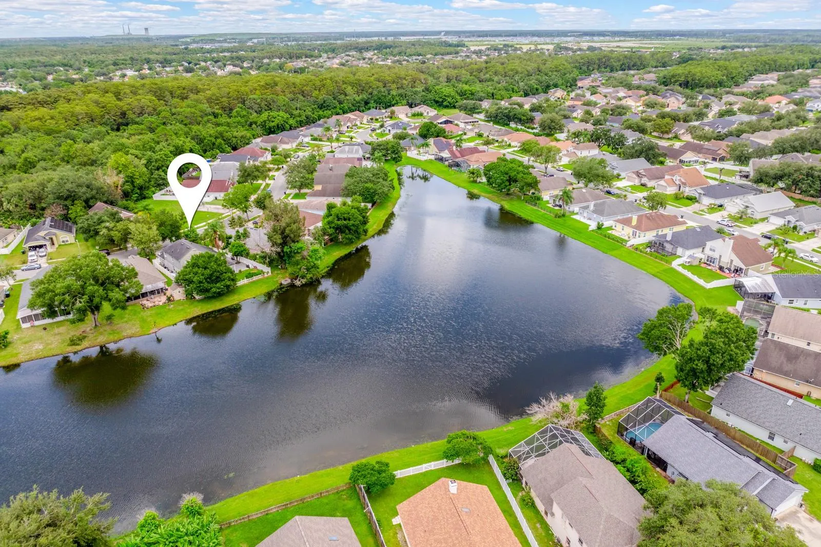 Aerial view of the home and community.