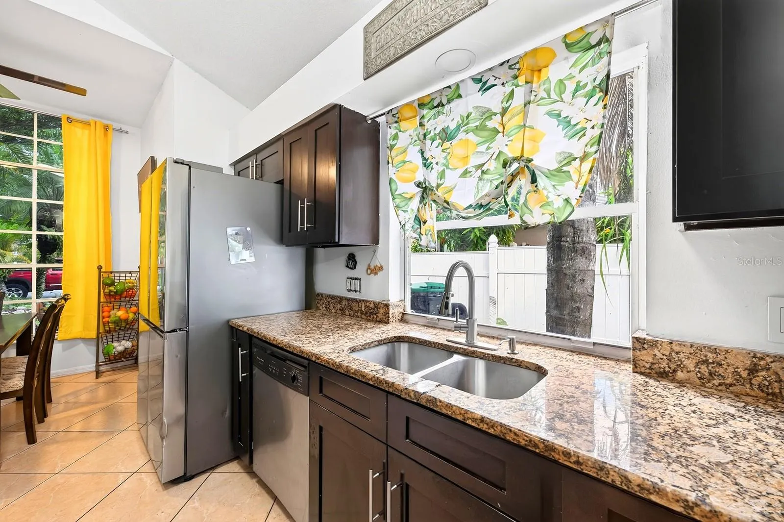 The spacious Kitchen is designed for both everyday meals and entertaining, offering STONE COUNTERTOPS, abundant cabinetry, and STAINLESS STEEL APPLIANCES.