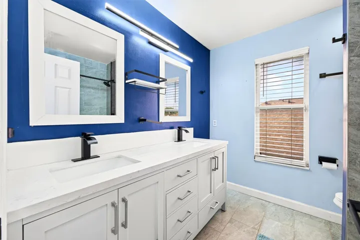 Three additional Bedrooms with LAMINATE FLOORING, and another UPDATED FULL BATH (2022), offer plenty of space for family, guests, a home office or hobbies.