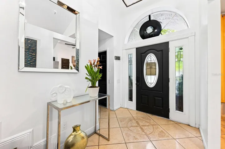 Step inside to TALL CEILINGS, beautiful TILE FLOORING and a bright, welcoming layout.