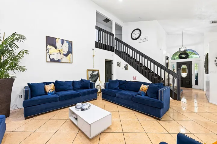 The OPEN-CONCEPT main living areas bring the Living Room and Dining Room together, with abundant windows allowing NATURAL LIGHT to fill the space.