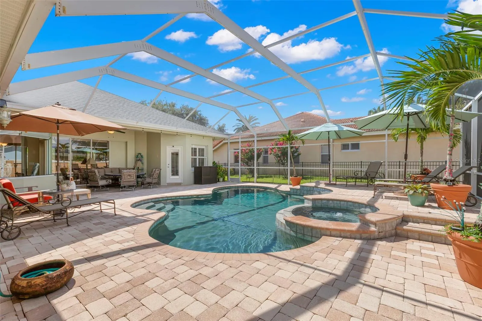 Expansive pavers surrounding the pool