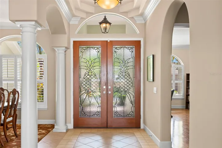 Nothing says "Welcome" better than Custom Entry Doors with Leaded-Glass Pineapple Accents