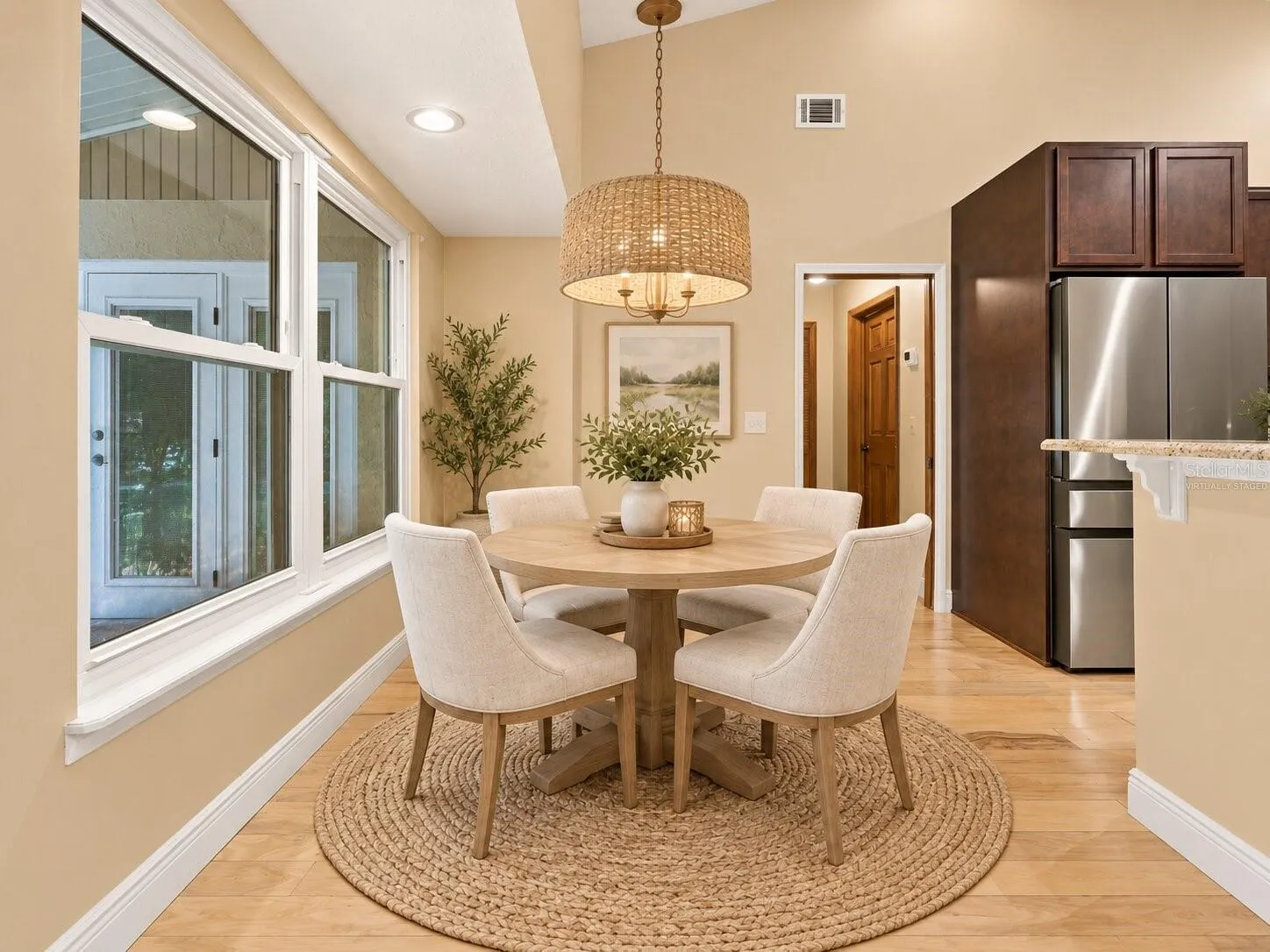 Virtually staged eat-in kitchen area.