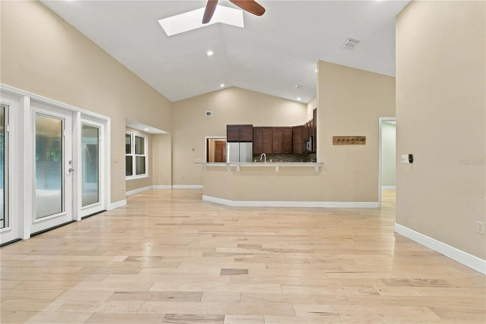 Open-concept living area with views toward the kitchen.