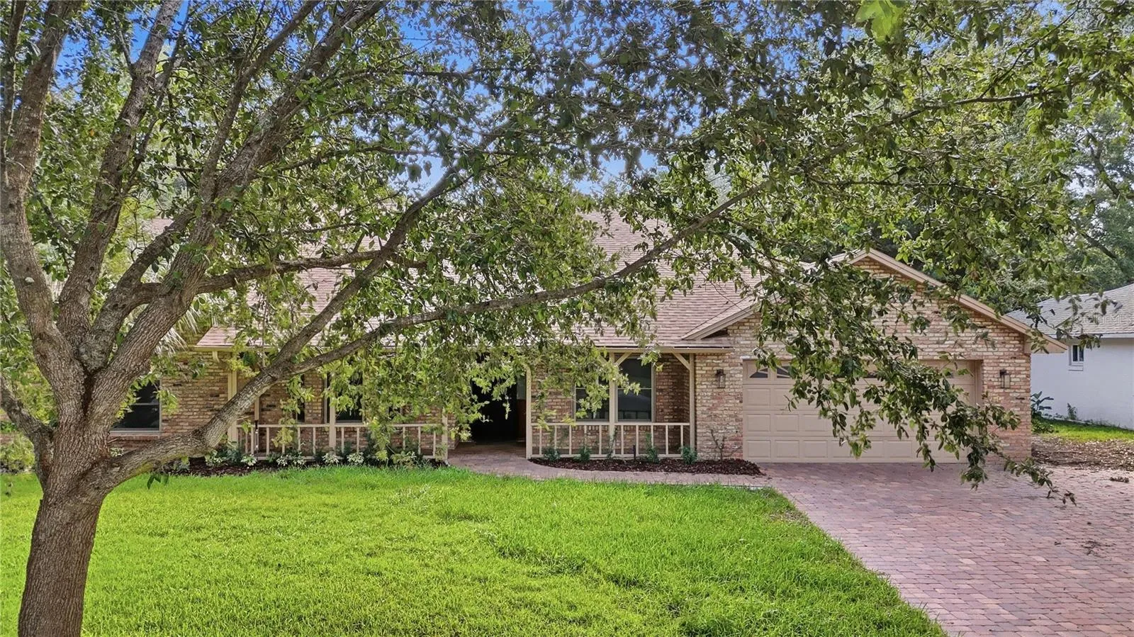 Welcoming front exterior with established landscaping.