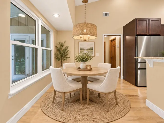 Virtually staged eat-in kitchen area.
