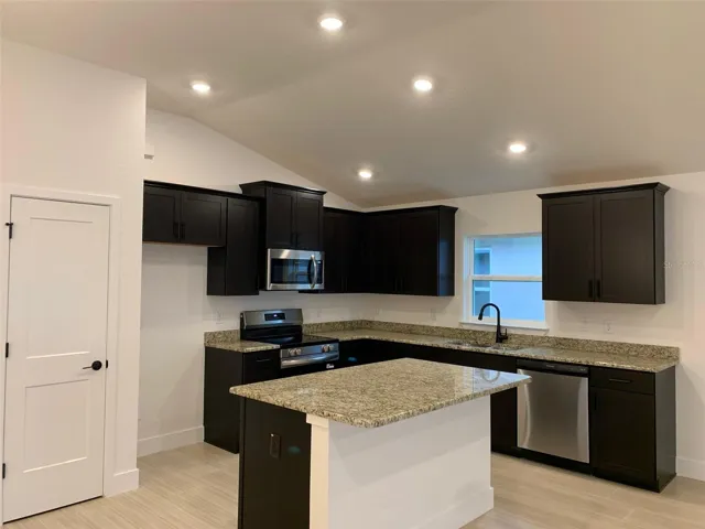 Kitchen w/wood cabinets and granite countertops