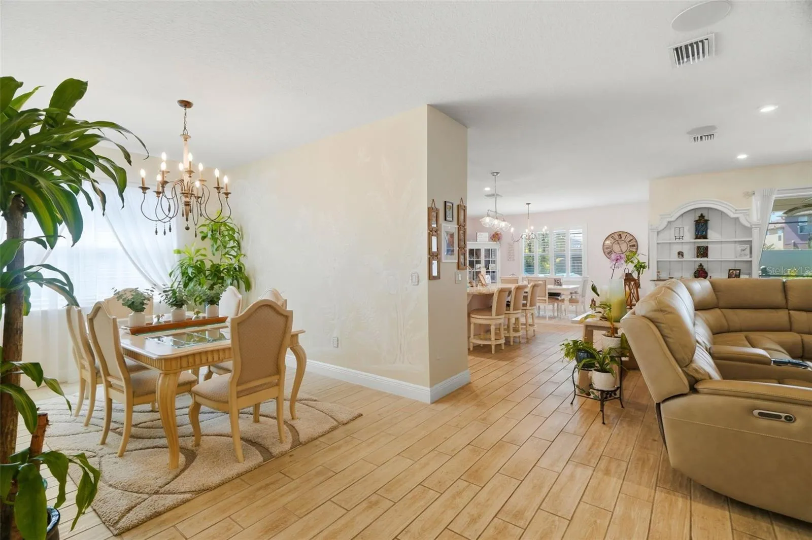 Formal dining room with custom decorative wall and ceiling finishes.