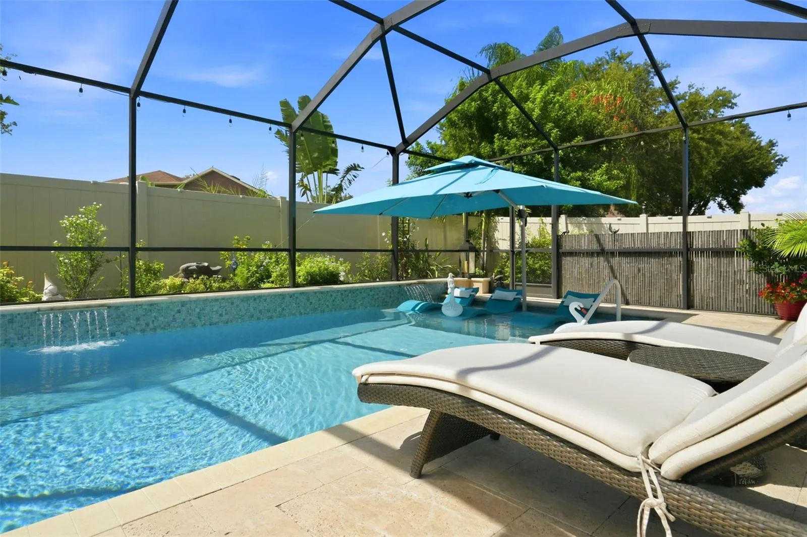 Saltwater pool with sun shelf, water features and a pool heat circulator pump replaced in 2025. Pool deck recently cleaned and sealed.