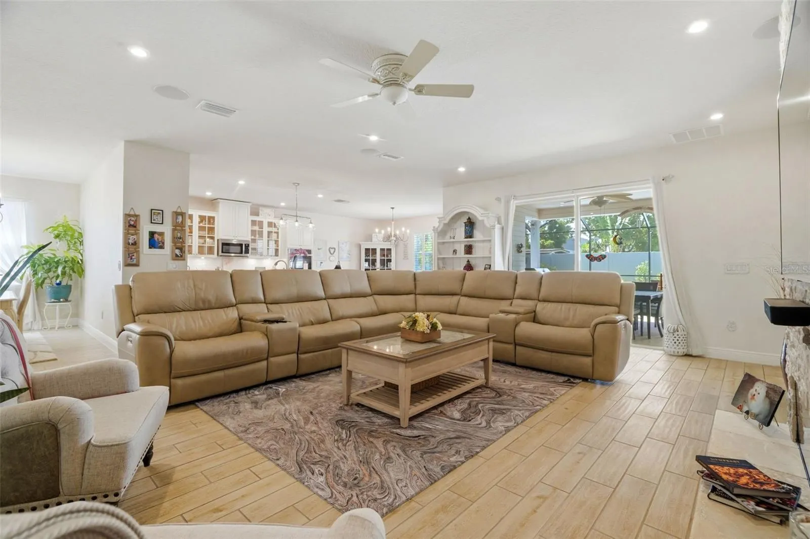 Bright, open living room with large-format tile flooring and custom interior finishes.