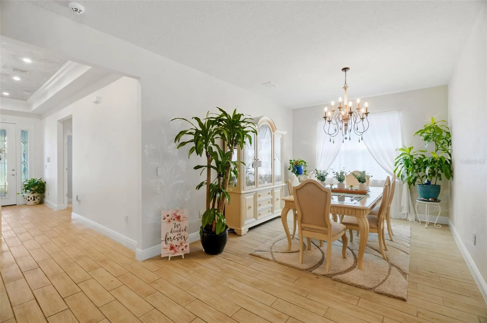 Custom faux-finish painting adds depth and character throughout the home.