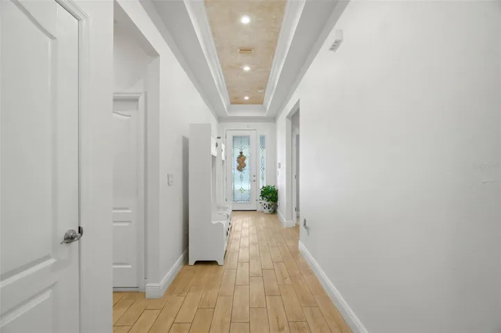 Custom decorative ceiling finish and recessed lighting add detail beyond the original builder package.