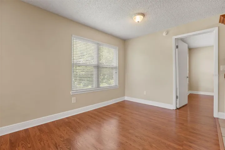 Living/doning area and entrance to primary bedroom