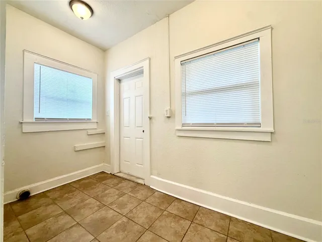 washer/ dryer hookup located right off the end of the kitchen area. Door leads to backyard