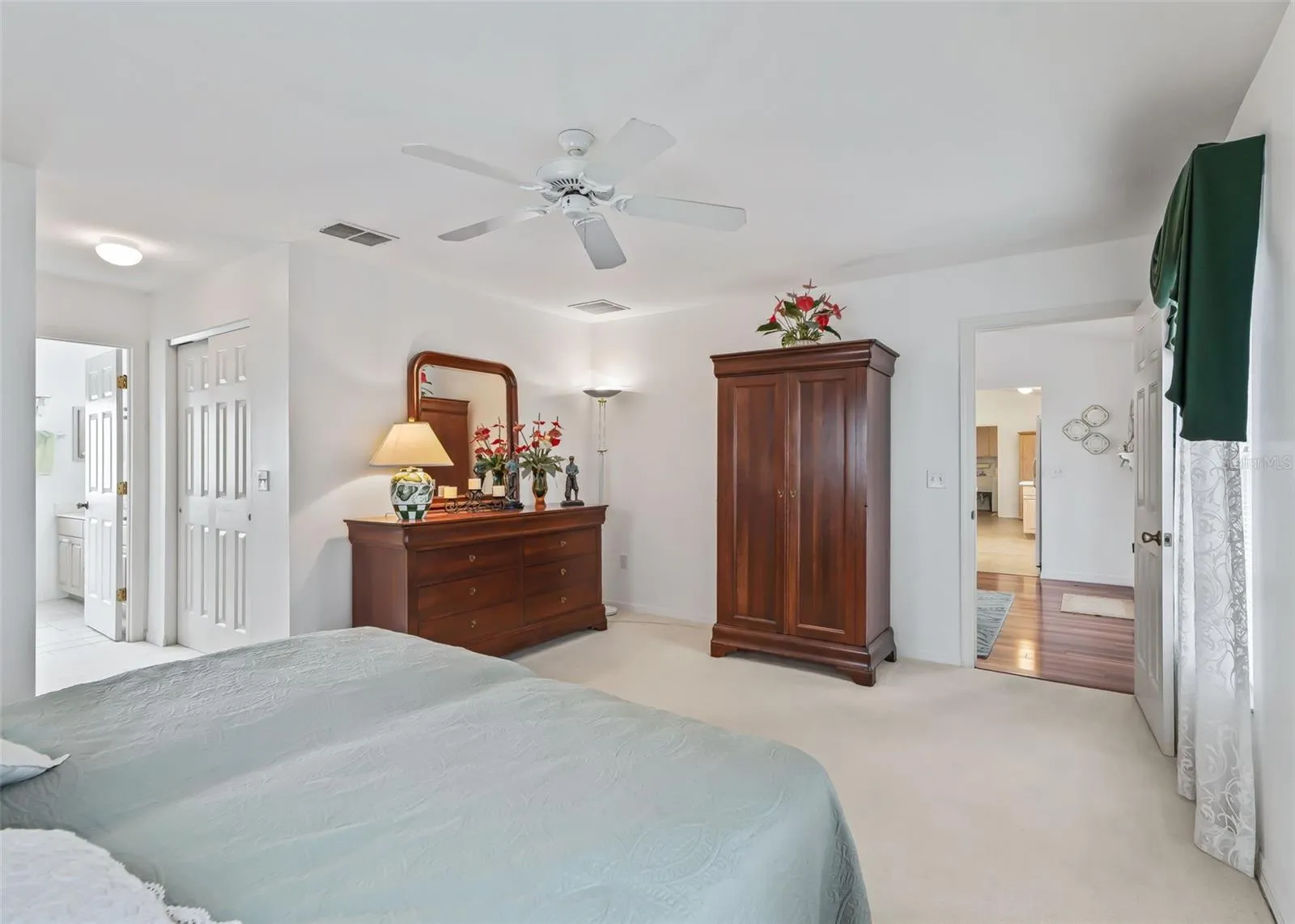 Luxurious and spacious primary suite offers a private retreat with an inviting sense of comfort and elegance. The generously sized bedroom provides plenty of room to relax and unwind, complemented by a private ensuite bathroom for a truly comfortable and serene experience.