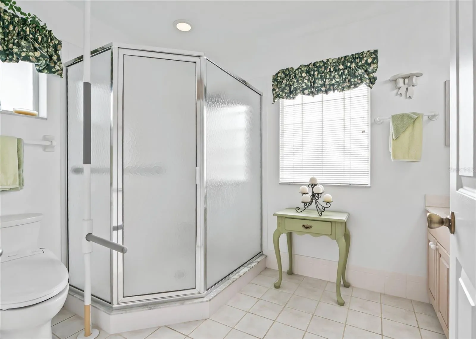 Bright and spacious ensuite bathroom features a large walk-in shower