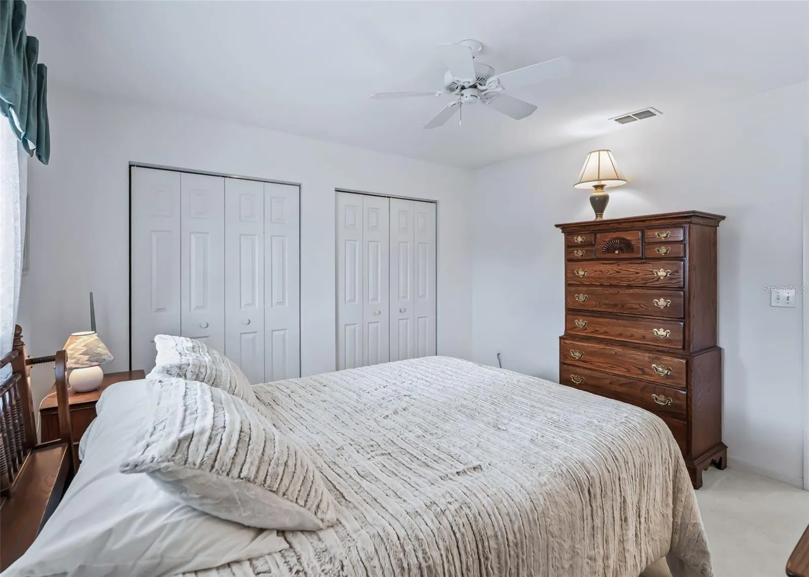 Guest bedroom features two closets, providing generous storage space