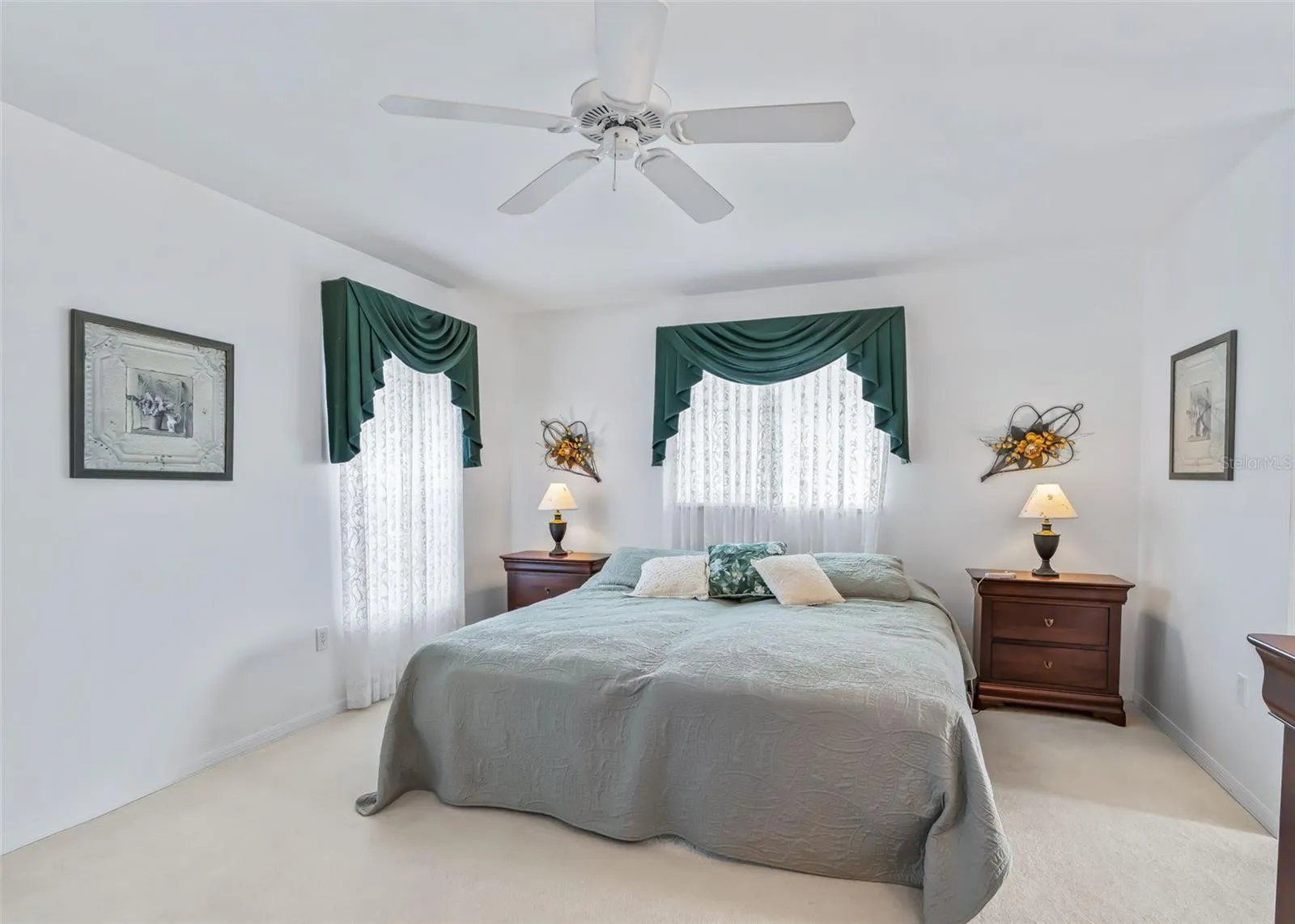 Large, bright primary suite features plenty of natural light creating a comfortable and inviting retreat.