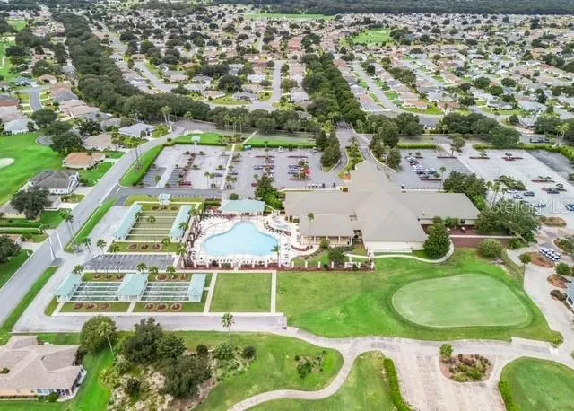 Aerial view showcases the community center and its surrounding amenities, highlighting the inviting community setting and convenient access to neighborhood gathering spaces.