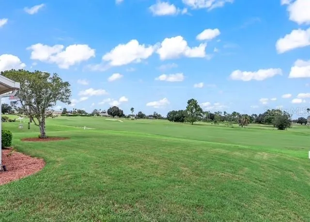 Beautiful golf course views stretch across the backyard, creating a peaceful and picturesque setting to enjoy the outdoors and Florida lifestyle.