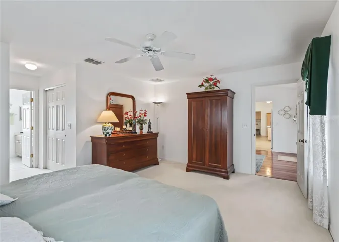 Luxurious and spacious primary suite offers a private retreat with an inviting sense of comfort and elegance. The generously sized bedroom provides plenty of room to relax and unwind, complemented by a private ensuite bathroom for a truly comfortable and serene experience.