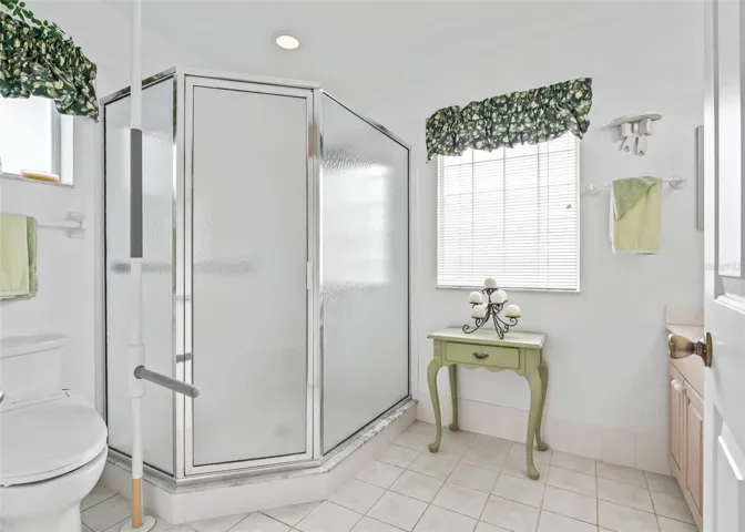 Bright and spacious ensuite bathroom features a large walk-in shower