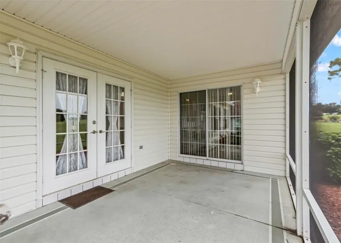 Spacious screened lanai provides a comfortable outdoor living area, perfect for relaxing, entertaining, and enjoying the beautiful Florida weather.