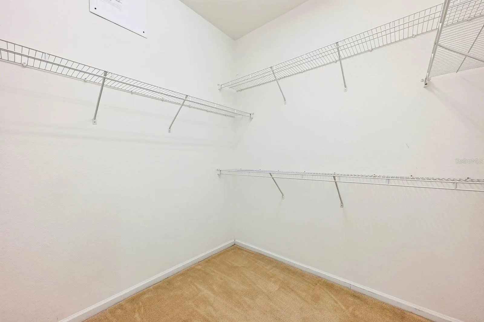 Primary suite walk-in closet.