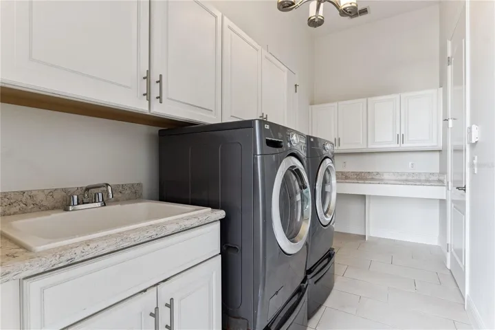Laundry Room with Upper and Base Cabinetry