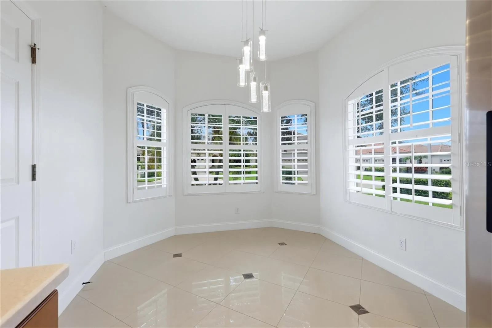 Dinette Area with Bay Window and Plantation Shutters