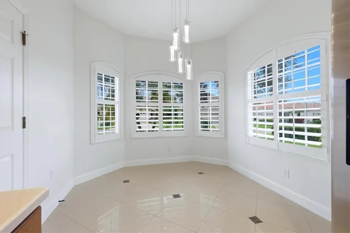 Dinette Area with Bay Window and Plantation Shutters