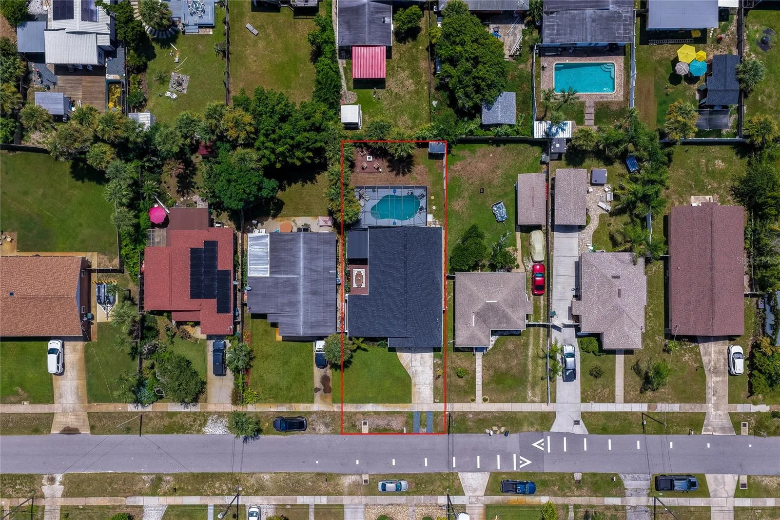 Direct overhead aerial view mapping out the property boundaries, surrounding residential neighborhood, and lot size.