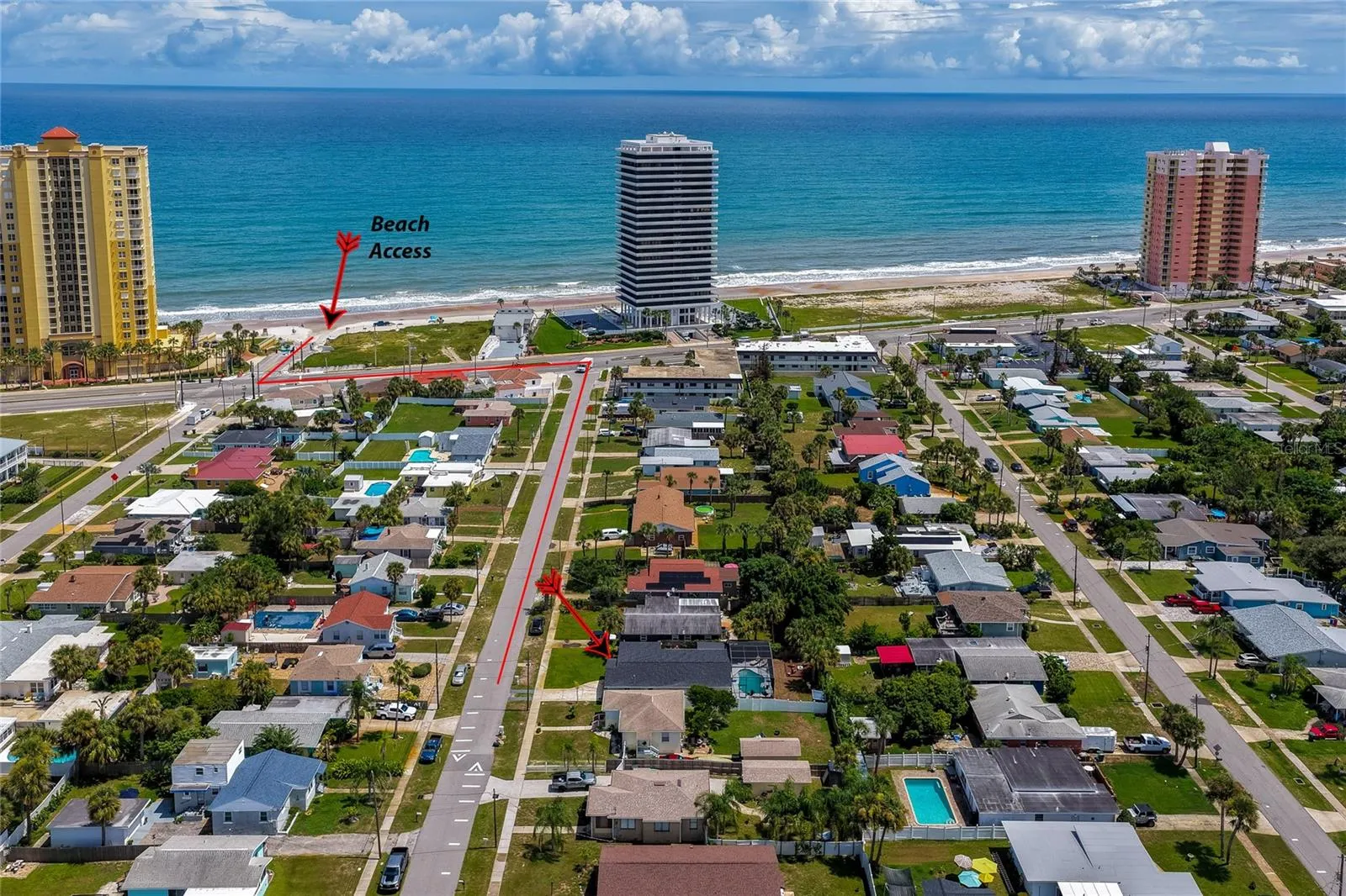 Aerial neighborhood photo with annotated directions showing the quick, direct route down the street to local beach access.