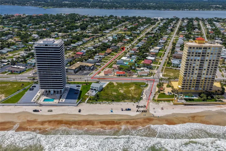 Direct ocean-facing aerial photo mapping the short, straight route from the property to the sandy beach and public beach access point.
