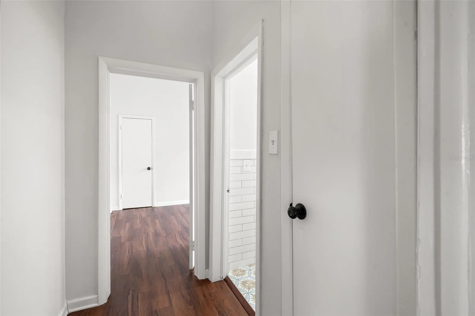 Hallway to front bathroom and second bedroom