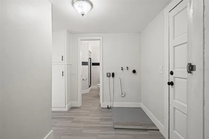Laundry/mud room combo leading to back bathroom