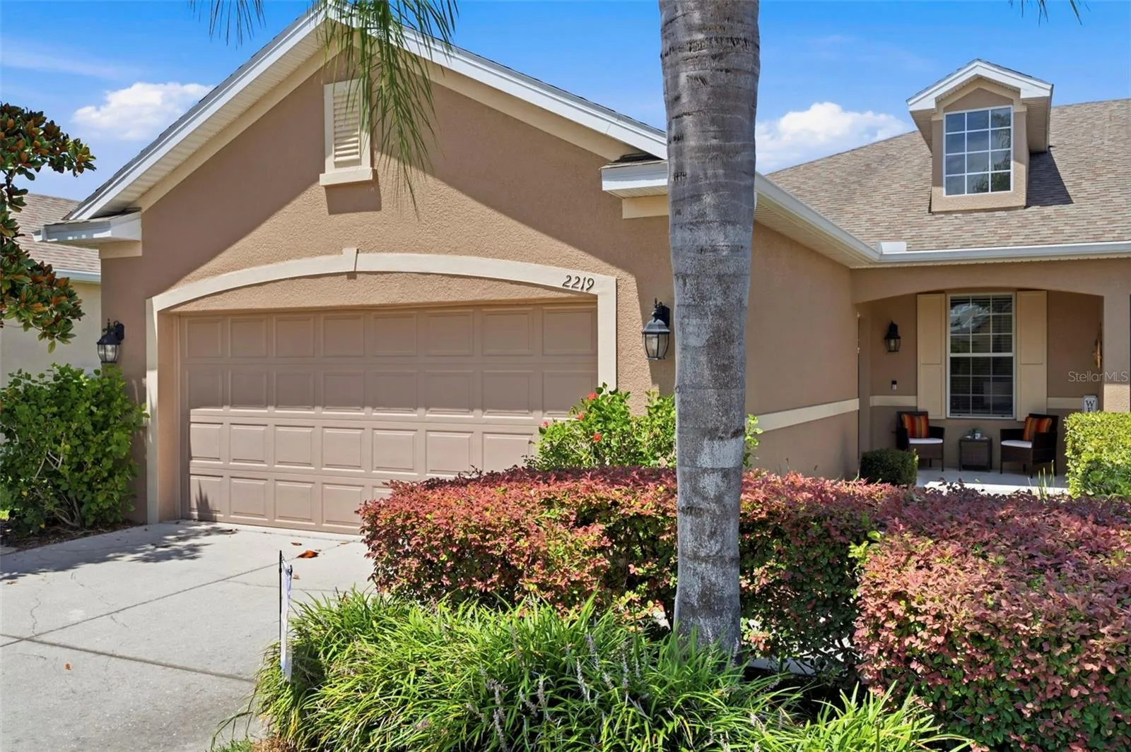 Front Elevation with lush  landscape
