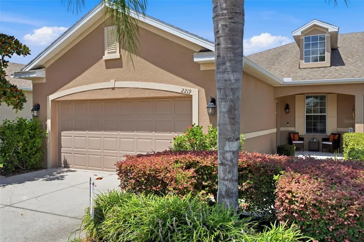 Front Elevation with lush  landscape