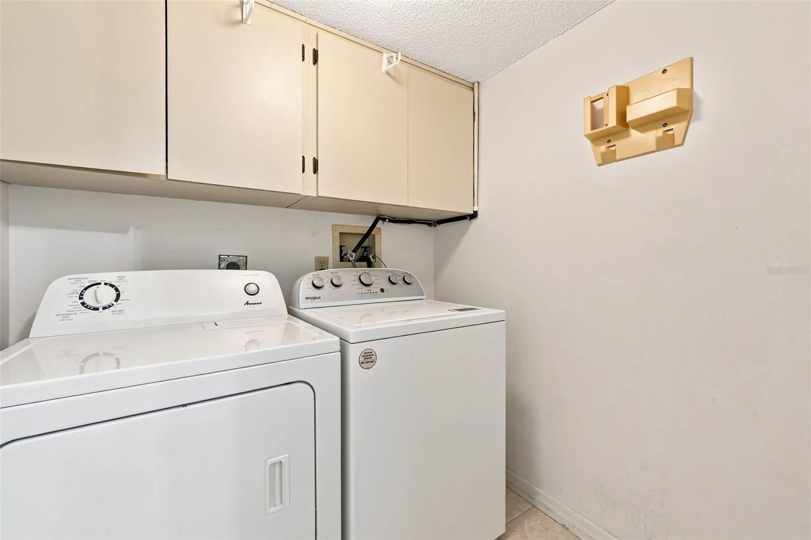Laundry room inside the condo