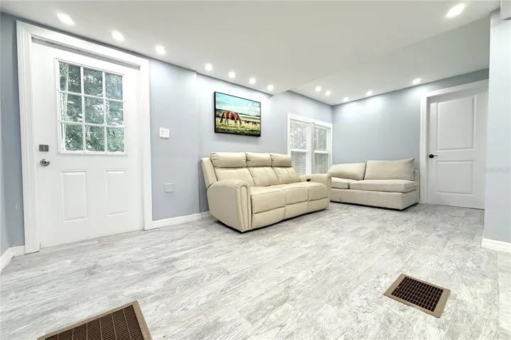LIVING ROOM EXIT  TO DECK AND BACK YARD