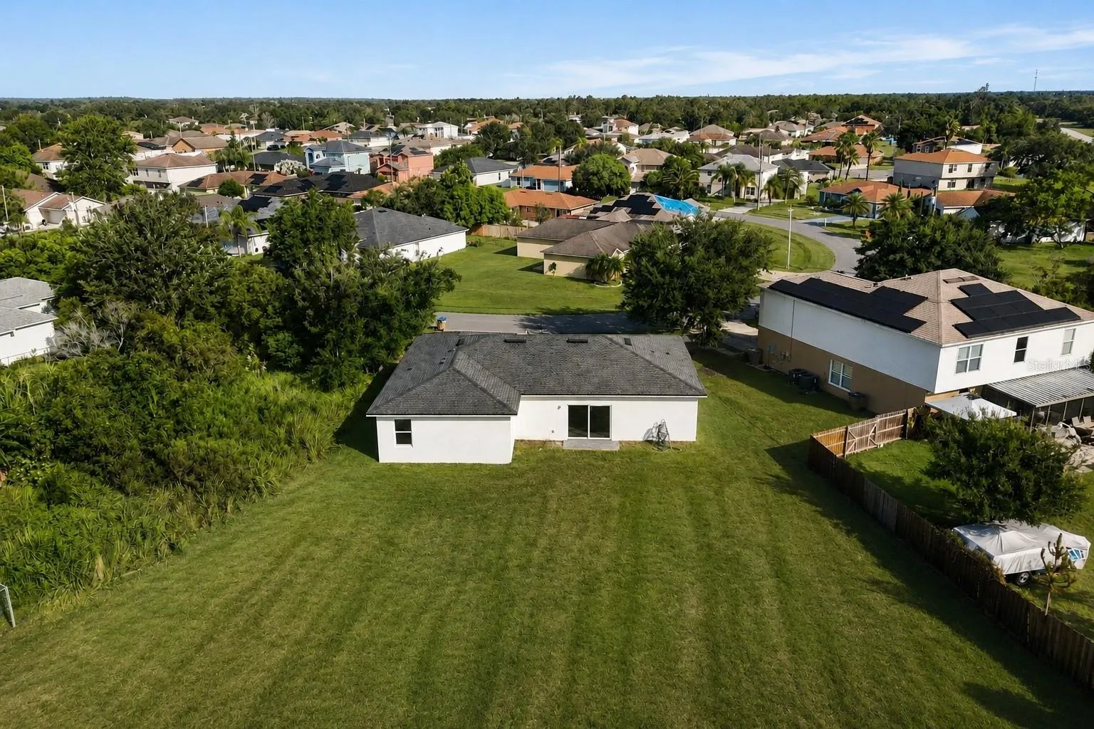 Aerial view of the property and the community