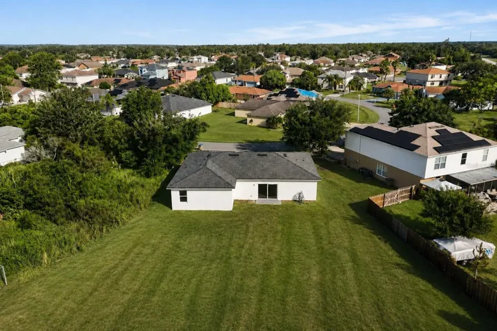 Aerial view of the property and the community