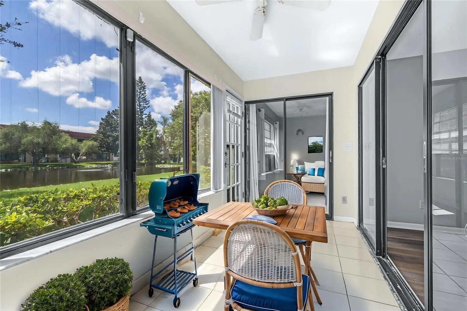 Virtually stagedFully enclosed Florida room overlooking duck pond