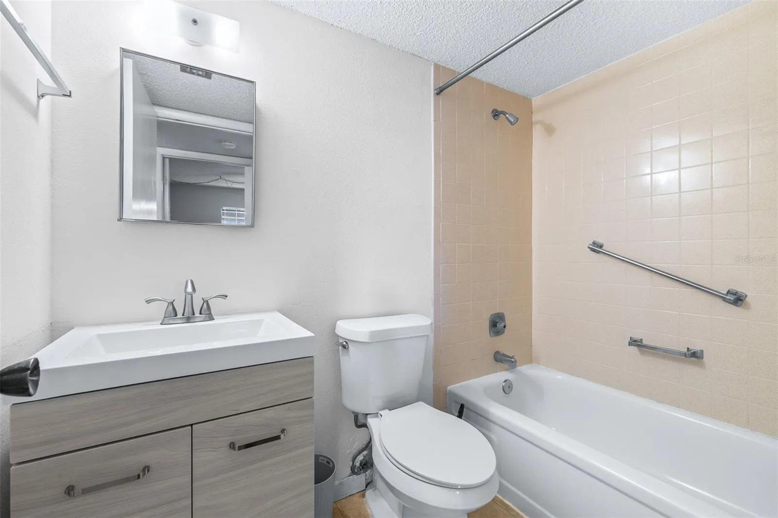 Guest bathroom directly across from guest bedroom
