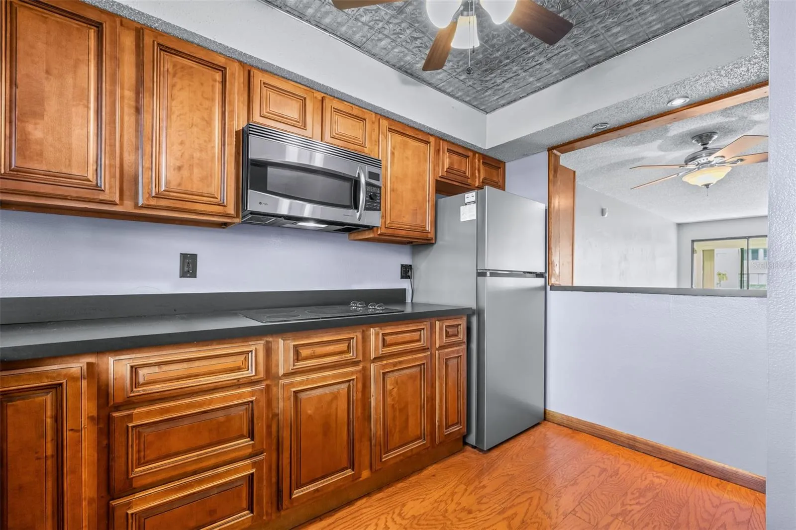 Brand new refrigerator with pass-through to dining/living area