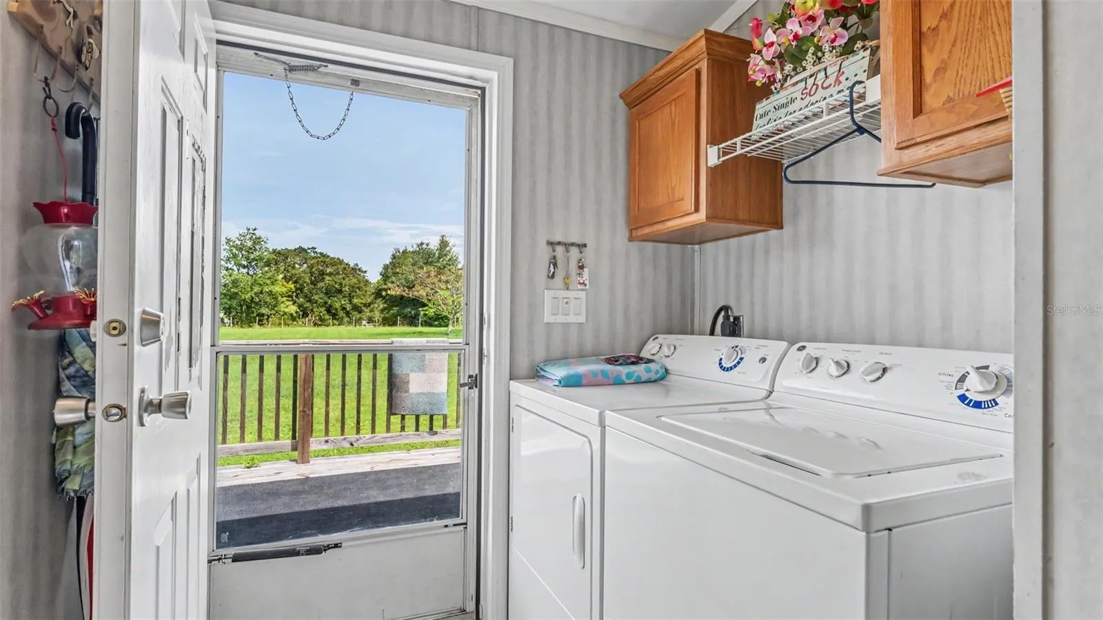 laundry room that leads to the back deck/porch