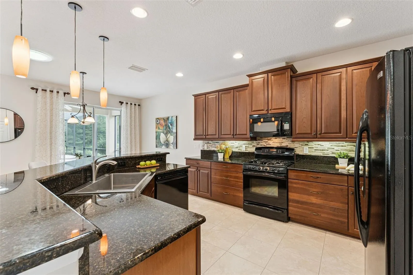 12'6" x 14' Kitchen w/ granite countertops, 42" Maple cabinets, under cabinet lighting & a Listello tile backsplash