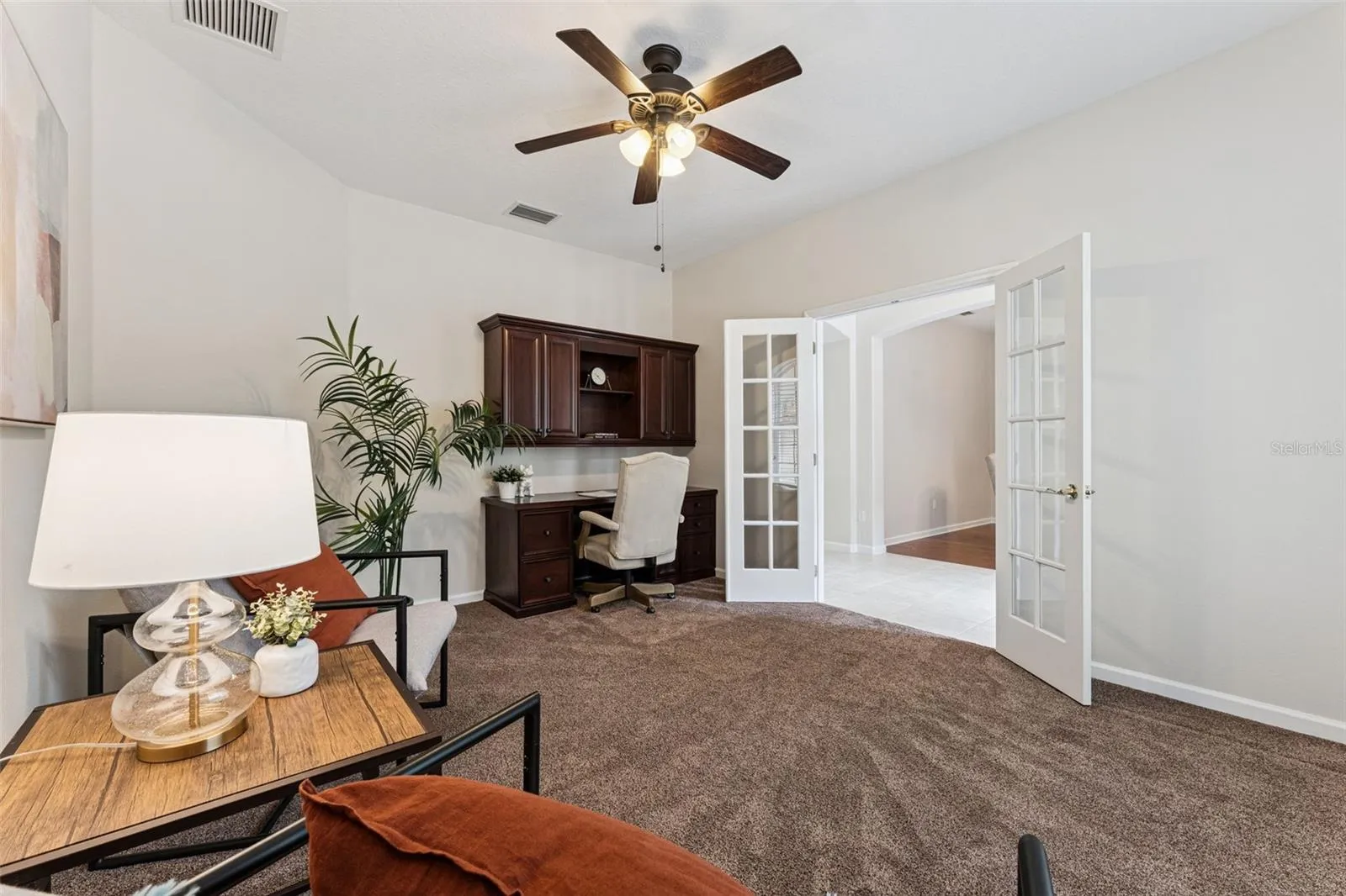 Den/office w/ a double french door entry