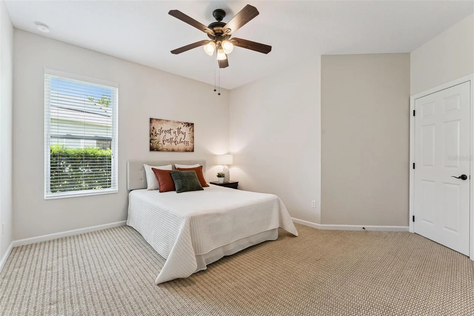 12' x 13' Bedroom #3 w/ a walk-in closet & a ceiling fan